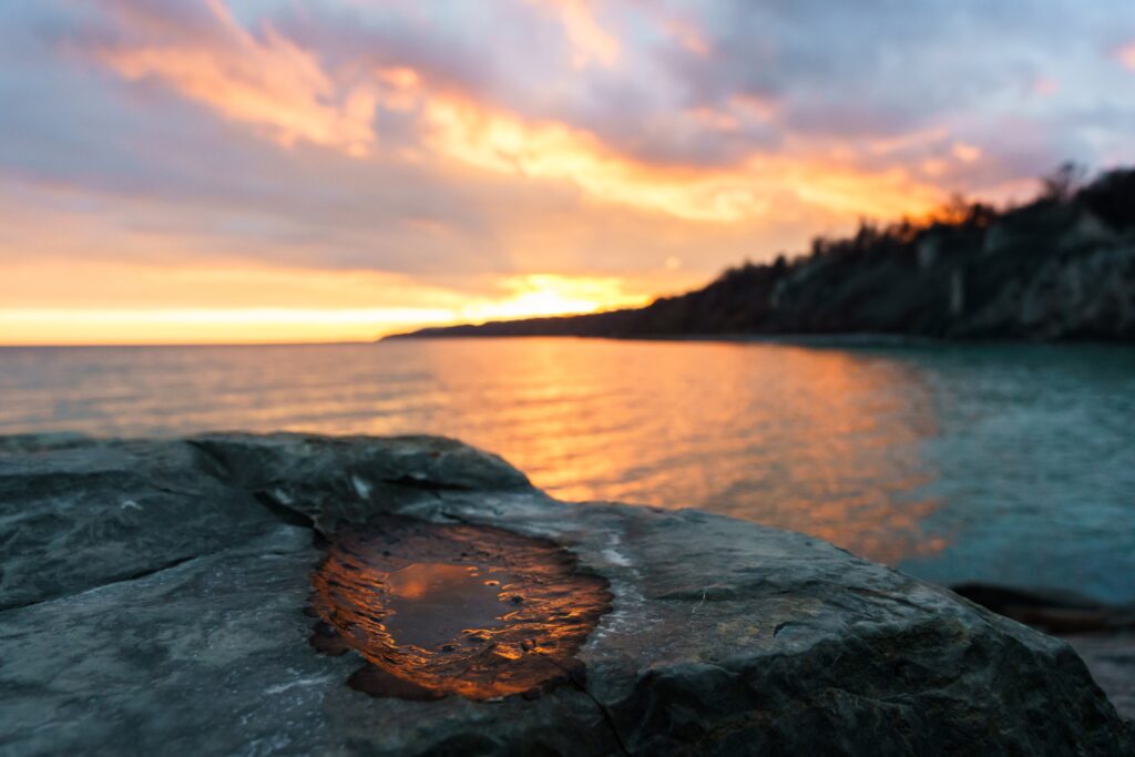 Sunset reflection on a rock